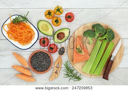 Healthy eating to improve brain power and memory on rustic wood background. Super food high in minerals,  proteins, vitamins, antioxidants, omega 3, fatty acids and anthocyanins. Top view.