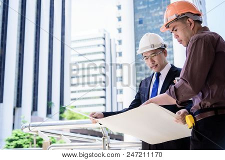 Two Asian Business And Engineer Man Has Planning And Working For Design Buiding And City.