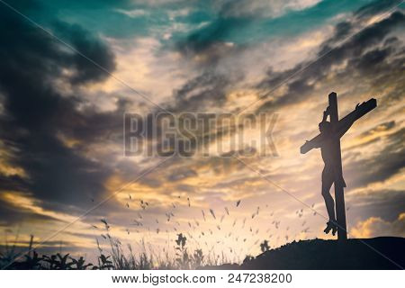 Silhouette Of Jesus With Cross Over Sunset Concept For Religion, Worship, Christmas, Easter, Redeeme