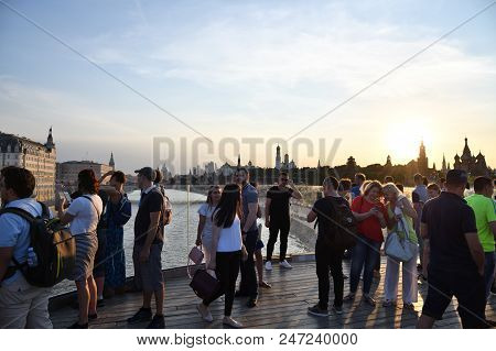 Moscow, Russia - June 23, 2018: People Resting On Floating Bridge In Zaryadye Park At Sunset. Zaryad