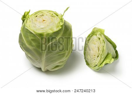 Fresh organic pointed cabbage cut in two pieces isolated on white background
