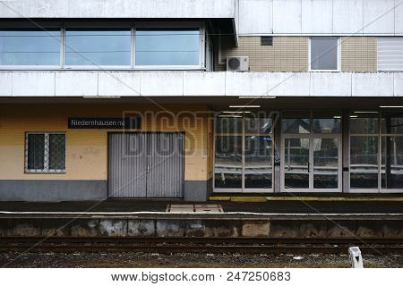 An Empty Station Building Of Niedernhausen Station With Barred Windows And A Clinker Facade.