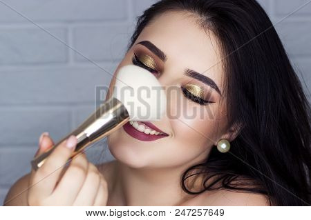 Beautiful Brunette With Professional Make-up