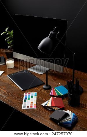 Close Up View Of Graphic Designer Workplace With Colorful Pallet, Graphic Tablet, Blank Computer Scr