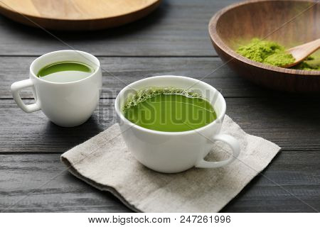 Cups Of Fresh Matcha Tea On Table