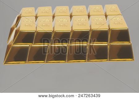 Stacked Bars Of Gold Bullion On A Gray Background.financial Concept