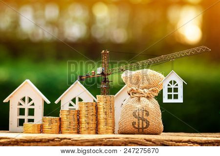 Home And Stacking Gold Coins With Increase And Tower Crane And Hoist Brake Solutions With Money Bag 