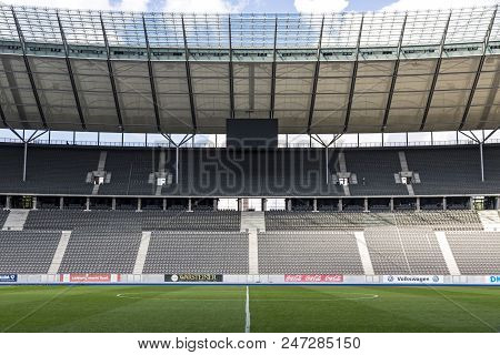Berlin, Germany - September 20, 2017: Green Grass Pitch And Empty Tribunes Of Olympiastadion (olympi