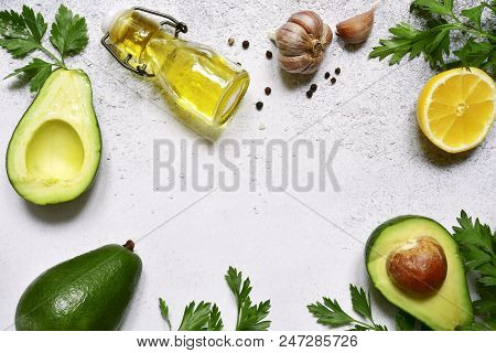 Food Background With Ingredients For Making Mexican Avocado Dip Guacamole.top View With Copy Space.