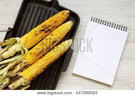 Grilled Corn On The Cob, Notepad. Flat Lay.