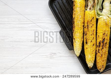 Flat Lay Of Grilled Corn On The Cob In A Grilling Pan. Copy Space.
