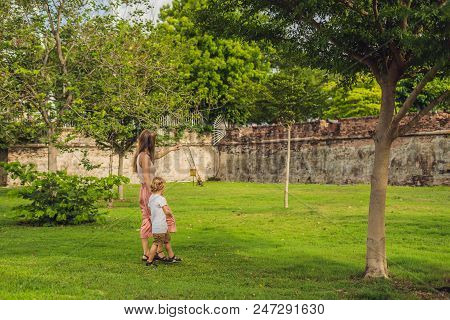 Mom And Son On Background Of Fort Cornwallis In Georgetown, Penang, Is A Star Fort Built By The Brit