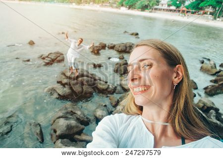 Portrait Of A Woman: Takes A Selfie On The Beach. Girl On Vacation