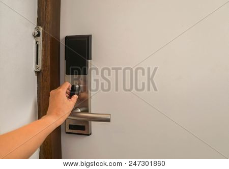 Close Up Woman Hand Twist Door Lock In Hotel For Safety