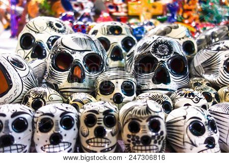Isla Mujeres, Mexico - Feb 8, 2016: Colorful Ceramic Souvenir Dia De Los Muertos Skulls At A Sidewal