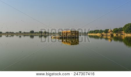View Of Gadsisar Lake With Ancient Hindu Temples At Sunny Day In Jaisalmer, India.