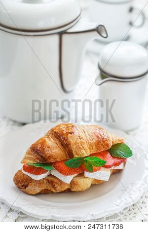 Croissant With Strawberries, Brie Cheese Or Camambert And Mint. Delicious Gourmet Breakfast. Selecti