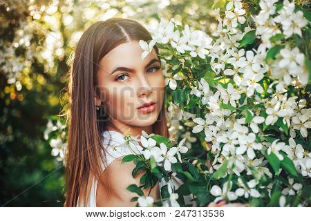 Pretty Girl Portrait Near Blossomed Tree In Park. Concept Of Youth And Natural Beauty. Young Girl Sm
