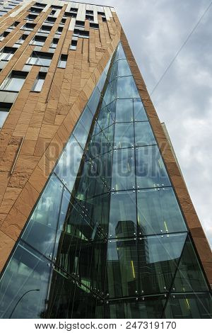Modern Architecture In The City.the Building At A Low Angle View.reflections In The Glass