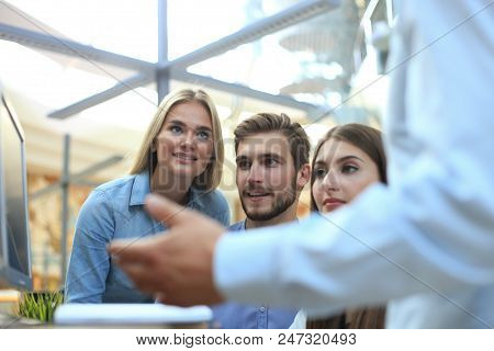Group Of Young Modern People In Smart Casual Wear Having A Brainstorm Meeting While Standing In The 