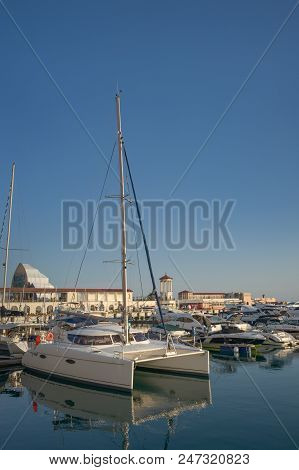 Sochi, Russia-june 14, 2018: Vertical Sea View With Beautiful White Catamaran In The Port