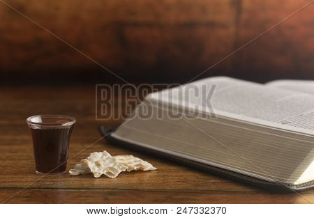 Christian Communion On A Wooden Table With A Bible