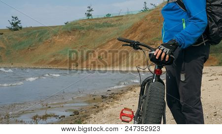Fat Bike Also Called Fatbike Or Fat-tire Bike In Summer Driving On The Beach. The Guy Is Going Strai