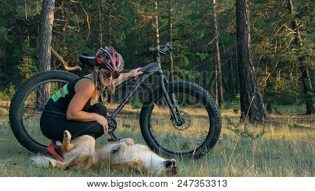 Fat Bike Also Called Fatbike Or Fat-tire Bike In Summer Riding In The Forest. Beautiful Girl And Her