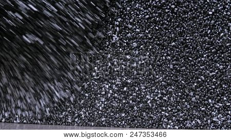 Plastic Black Gray Granulated Crumb. Manufacture Of Plastic Water Pipes Of The Factory. Process Of M