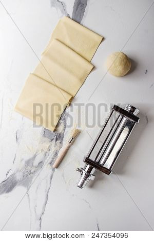 Rolled Dough For Homemade Italian Uncooked Pasta Lasagna From Pasta Machine Maker With Semolina Flou