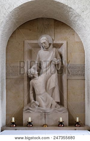 MUNSTERSCHWARZACH, GERMANY - JULY 09: Saint Mauro rescues young Placidus from drowning, altar in Munsterschwarzach Abbey, Benedictine monastery, Germany on July 09, 2017.