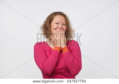 Pretty European In Pink Pulover Is Shy To Hear A Compliment. She Is Hiding Her Face.