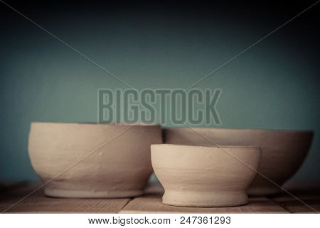 Ceramic Clay Products Stand On The Shelf Close-up.
