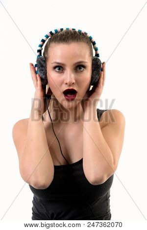 Surprised Woman Listening On Headphones - Mouth Open