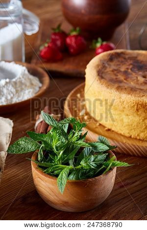 Fresh Mint Leaves In A Bowl On Wooden Table, Close-up, Selective Focus, Shallow Depth Of Field. Mint
