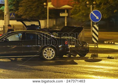 Car Accident In The Night City. Two Vehicles Crashed In A Metropolitan Street.