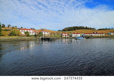 Cruising Ship Leaving A Historic Ranch Of Small Island On Beagle Channel, Ushuaia, Tierra Del Fuego,