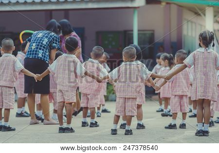 Young Kids Exercise With Hoola Hoop In The Morning.