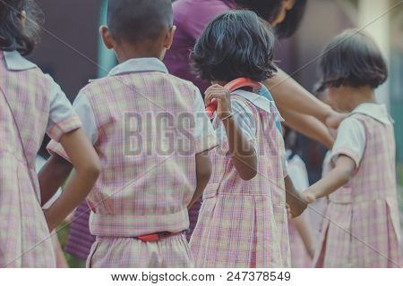 Young Kids Exercise With Hoola Hoop In The Morning.