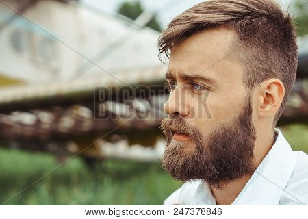 The Man In The Shirt Stands At The Old Plane