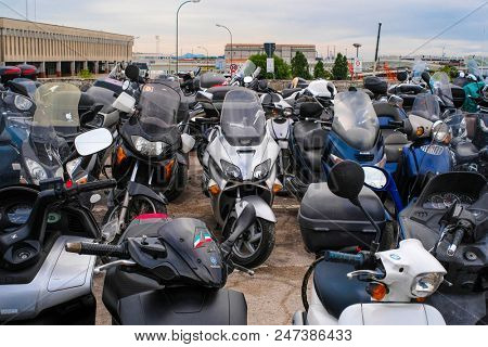 Venice, Italy - June, 28:  motorcycle parking in Venice, Italy. This parking is on the entrence of Venice. In this city not only cars or motorcycles, but bicycles cann't drive. Only boats.
