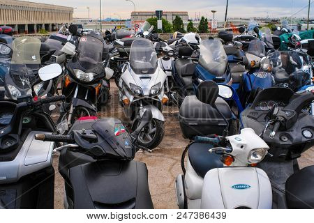 Venice, Italy - June, 28:  motorcycle parking in Venice, Italy. This parking is on the entrence of Venice. In this city not only cars or motorcycles, but bicycles cann't drive. Only boats.