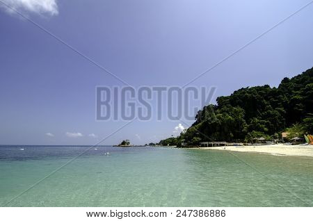 Scenic Sea View Of The Kapas Island At Terengganu, Malaysia. Clear Sea Water And Blue Sky Background