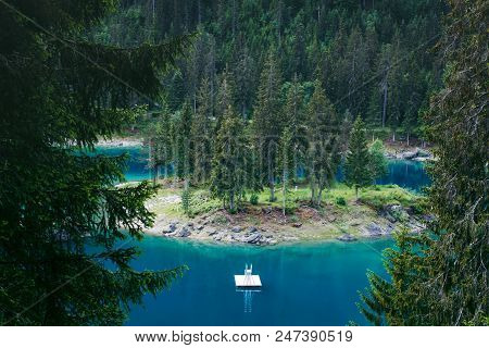 Caumasee Lake With A Small Island Located In The Middle Of The Crystal Clean Lake, Near Flims, Switz