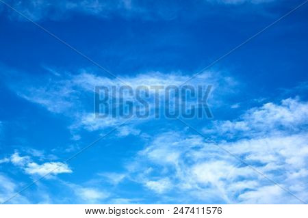 Beautiful Blue Sky With Fleecy Clouds. Abstract Background.