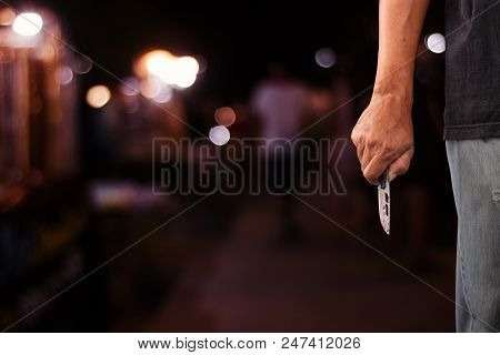 Man Holding Knife With Blood Dripping