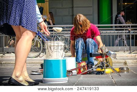 Bologna, Italy, 20 April 2018 - Street Drummer Play With Pots And  People Offer Money Tips For The A