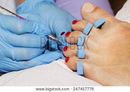 Woman Feet Receiving Pedicure. Close Up Concept