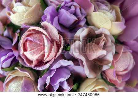 The Multicolored Аrtificial Flowers As A Background