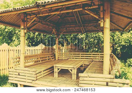 Bamboo Table And Seats Under A Bamboo Canopy Clouseup In A Bright Sunny Summer Day